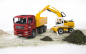 Preview: MAN TGA Kipplastwagen mit Liebherr Schaufelbagger